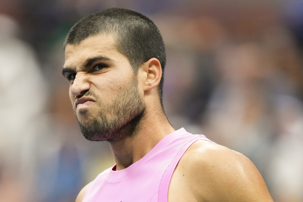 Carlos Alcaraz, of Spain, reacts after a rally against Jannik Sinner, of Italy, during the men's singles final of the U.S. Open tennis championships, Sunday, Sept. 7, 2025, in New York. (AP Photo/Kirsty Wigglesworth)