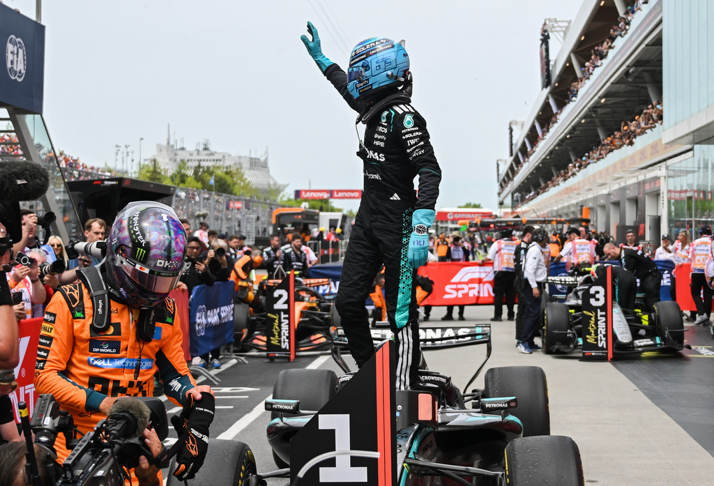 Mercedes driver George Russell, of Britain, waves after winning the sprint race at the F1 Canadian Grand Prix auto race in Montreal, Saturday, May 23, 2026. (Graham Hughes/The Canadian Press via AP)