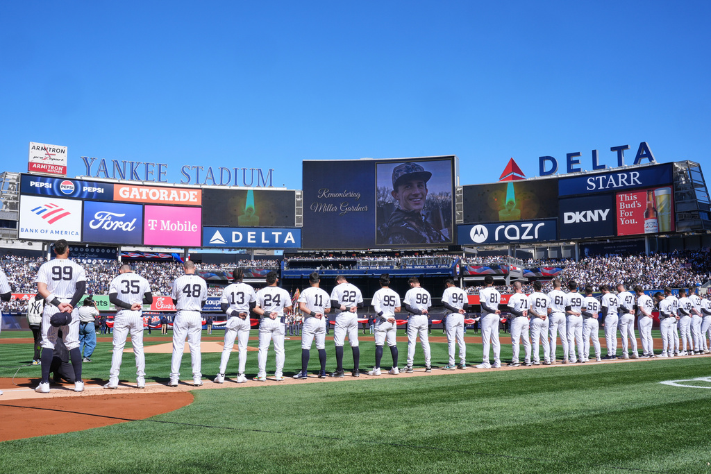 FILE - A moment of silence is observed for Miller Gardner, son of former New York Yankees player Brett Gardner, before the start of an opening-day baseball game between the Yankees and the Milwaukee Brewers at Yankee Stadium, March 27, 2025, in New York. (AP Photo/Seth Wenig, File)