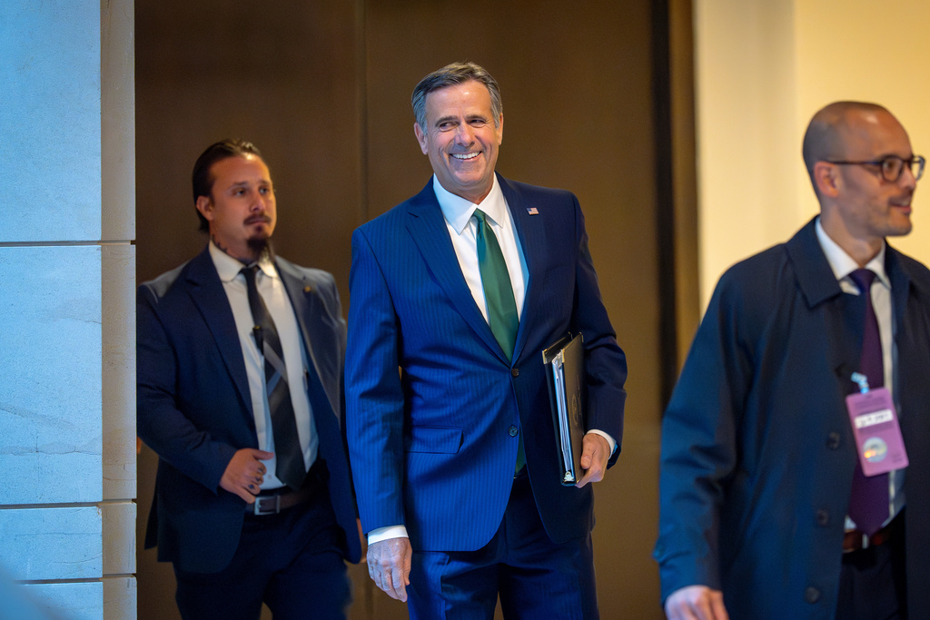 CIA Director John Ratcliffe walks to a secure room in the basement of the Capitol to join Defense Secretary Pete Hegseth to brief lawmakers on how he handled a military strike on a suspected drug smuggling boat and its crew in the Caribbean near Venezuela Sept. 2, in Washington, Tuesday, Dec. 9, 2025. (AP Photo/J. Scott Applewhite)