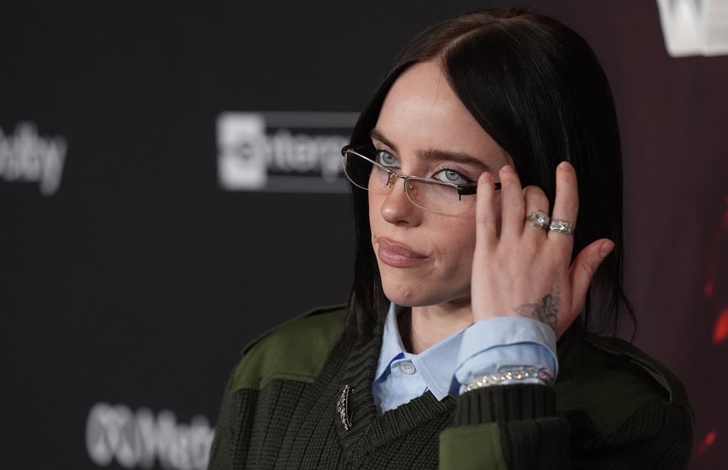 Singer Billie Eilish arrives at the premiere of the film "Avatar: Fire and Ash" on Monday, Dec. 1, 2025, at Dolby Theatre in Los Angeles. (AP Photo/Chris Pizzello)