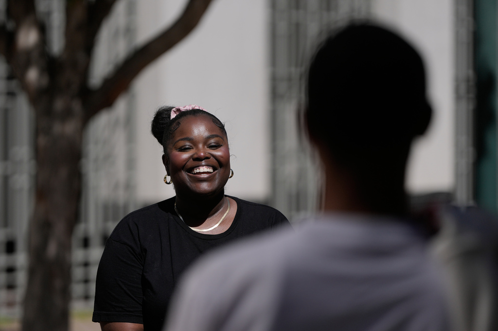 Oakland Ceasefire-Lifeline life coach LaSasha Long, left, laughs with Bernard C. during an interview Thursday, April 23, 2026, in Oakland, Calif. (AP Photo/Jeff Chiu)