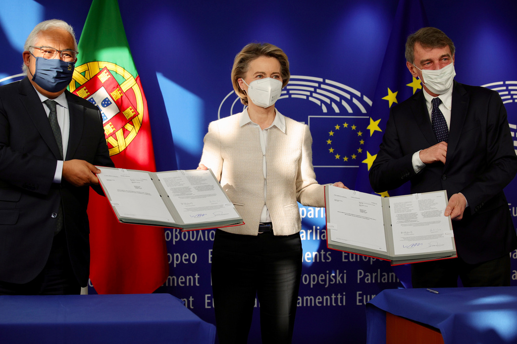 FILE - Portugal's Prime Minister Antonio Costa, left, European Commission President Ursula von der Leyen, center, and European Parliament President David Sassoli pose for photographers after a signing of the EU Recovery and Resilience Facility document, designed to help the bloc with the economic impact of COVID-19, at the European Parliament building in Brussels Friday, Feb. 12, 2021. (AP Photo/Olivier Matthys, File)