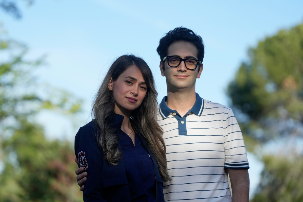 Dr. Zahra Shokri Varniab, left, and her husband, Ashkan Pourabhari Langroudi, pose for a photo Friday, May 1, 2026, in Palo Alto, Calif. (AP Photo/Jeff Chiu)