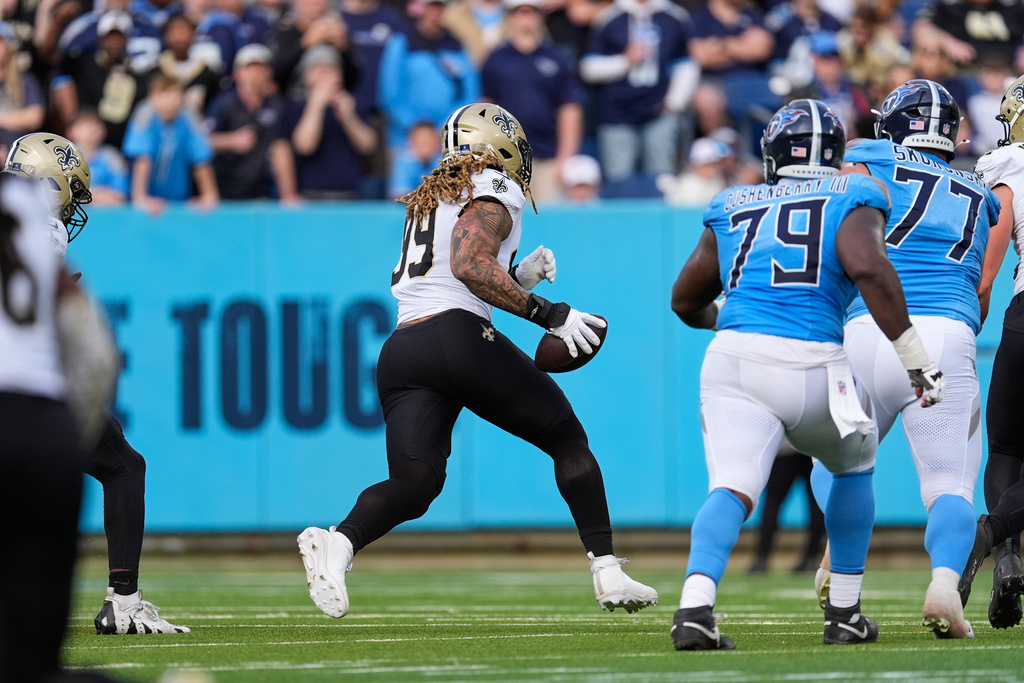 New Orleans Saints defensive end Chase Young (99) returns his strip for a touchdown in the first half of an NFL football game against the Tennessee Titans, Sunday, Dec. 28, 2025, in Nashville, Tenn. (AP Photo/George Walker IV)