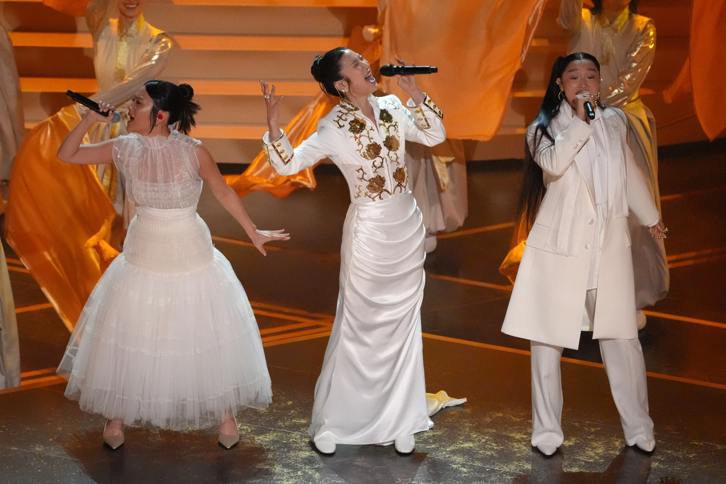 Rei Ami, from left, EJAE, and Audrey Nuna perform 'Golden' from "K-Pop Demon Hunters" during the Oscars on Sunday, March 15, 2026, at the Dolby Theatre in Los Angeles. (AP Photo/Chris Pizzello)