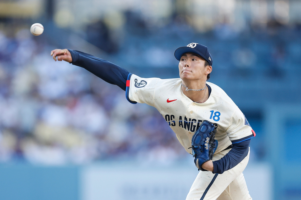 Los Angeles Dodgers starting pitcher Yoshinobu Yamamoto (18) throws during the second inning of a baseball game against the Boston Red Sox, Saturday, Aug. 1, 2026, in Los Angeles. (AP Photo/Caroline Brehman)