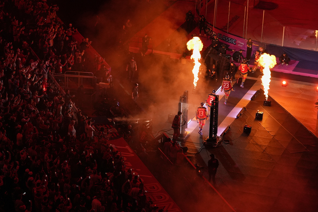 Florida Panthers players walk to the ice before the NHL Winter Classic outdoor hockey game between the Florida Panthers and the New York Rangers, Friday, Jan. 2, 2026, in Miami. (AP Photo/Rebecca Blackwell)