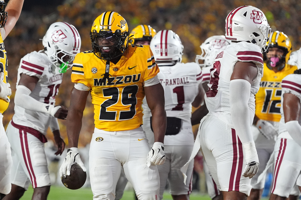 Missouri running back Ahmad Hardy (29) celebrates after scoring during the first half of an NCAA college football game against Massachusetts Saturday, Sept. 27, 2025, in Columbia, Mo. (AP Photo/Jeff Roberson)