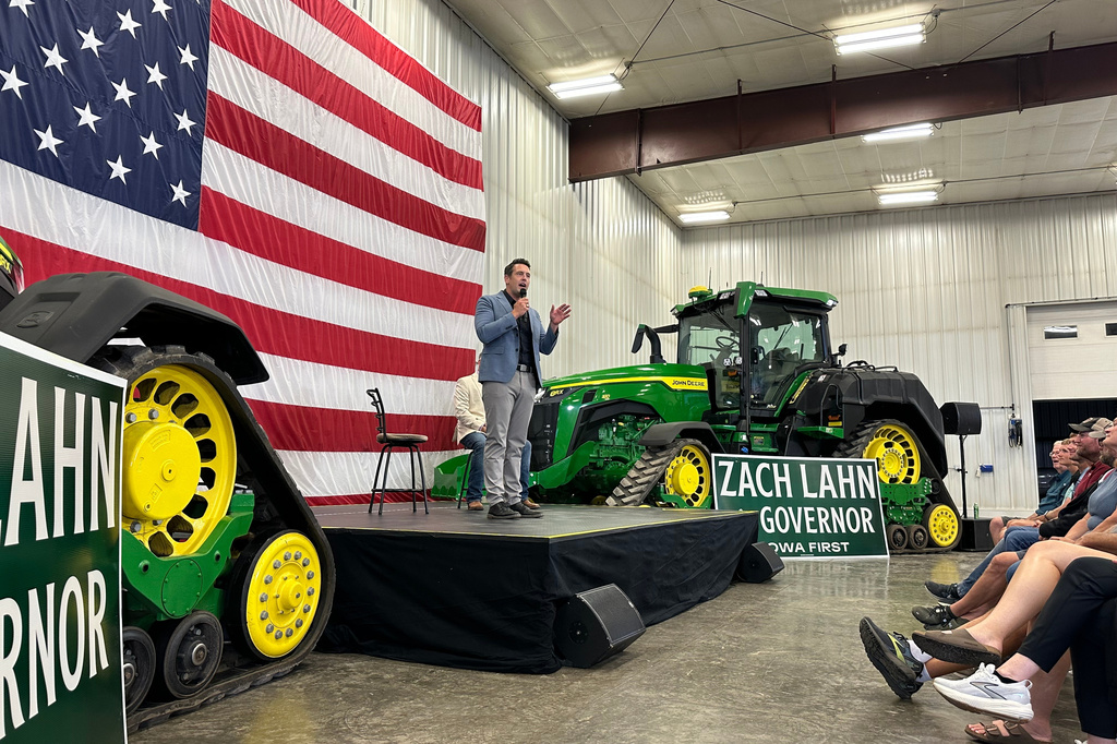 Zach Lahn, the Republican nominee for Iowa governor, talks to voters about agriculture in Arlington, Iowa, on Tuesday Aug. 4, 2026. (AP Photo/Hannah Fingerhut)