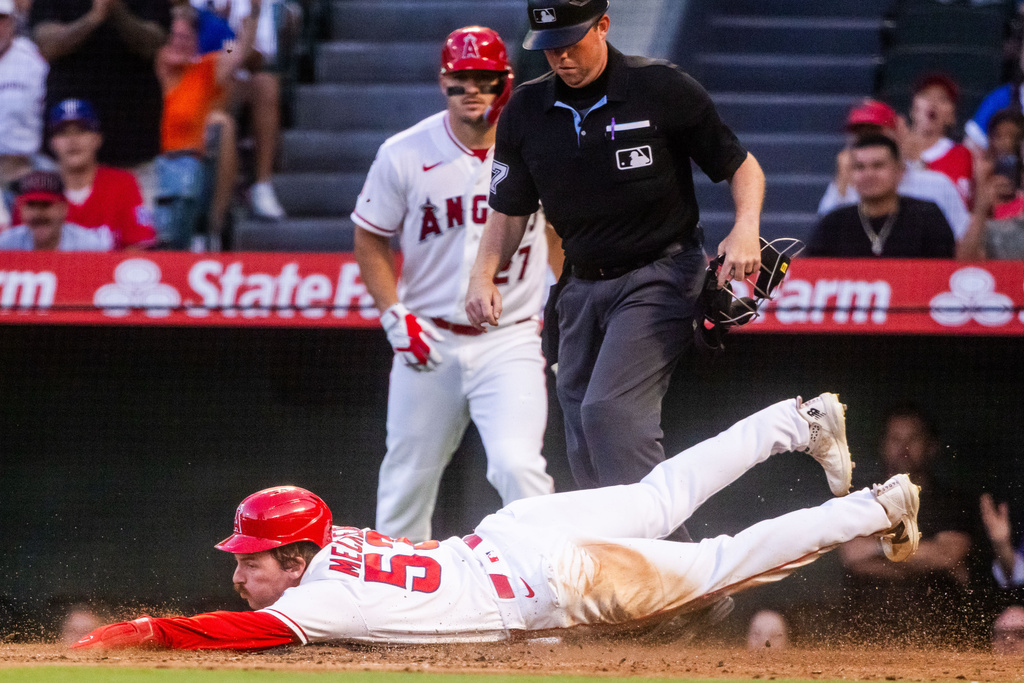 Los Angeles Angels left fielder Josh Lowe (3) slides to the bag during the 3rd inning of a baseball game against the Texas Rangers, Tuesday, Aug. 11, 2026, in Anaheim, Calif. (AP Photo/Ethan Swope)