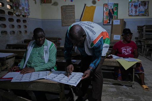 Officials count votes at a polling station in the Yopougon suburb of Abidjan, Ivory Coast, Saturday, Oct. 25, 2025, as polls close during the presidential elections. (AP Photo/Misper Apawu) Officials count votes at a polling station in the Yopougon suburb of Abidjan, Ivory Coast, Saturday, Oct. 25, 2025, as polls close during the presidential elections. (AP Photo/Misper Apawu)