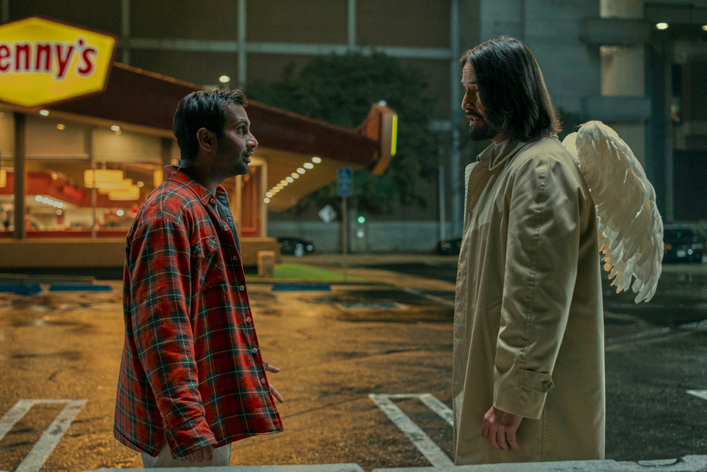 This image released by Lionsgate shows Aziz Ansari, left, and Keanu Reeves in a scene from "Good Fortune." (Eddy Chen/Lionsgate via AP)