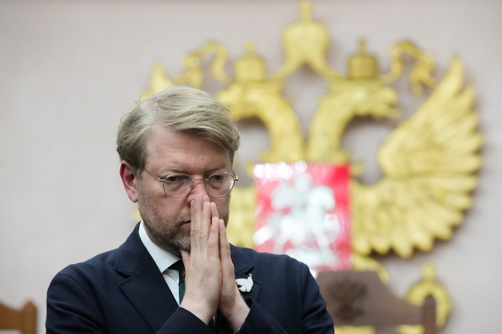Yabloko party leader Nikolai Rybakov stands after a hearing on a lawsuit to bar the party from the upcoming parliamentary elections, at the Russia's Supreme Court, in Moscow, Monday, Aug. 10, 2026. (AP Photo/Pavel Bednyakov)