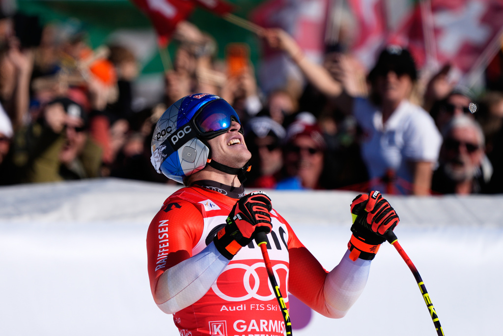 Switzerland's Marco Odermatt reacts at the finish area, during a men's World Cup downhill race, in Garmisch Partenkirchen , Germany, Saturday, Feb. 28, 2026. (AP Photo/Giovanni Auletta)