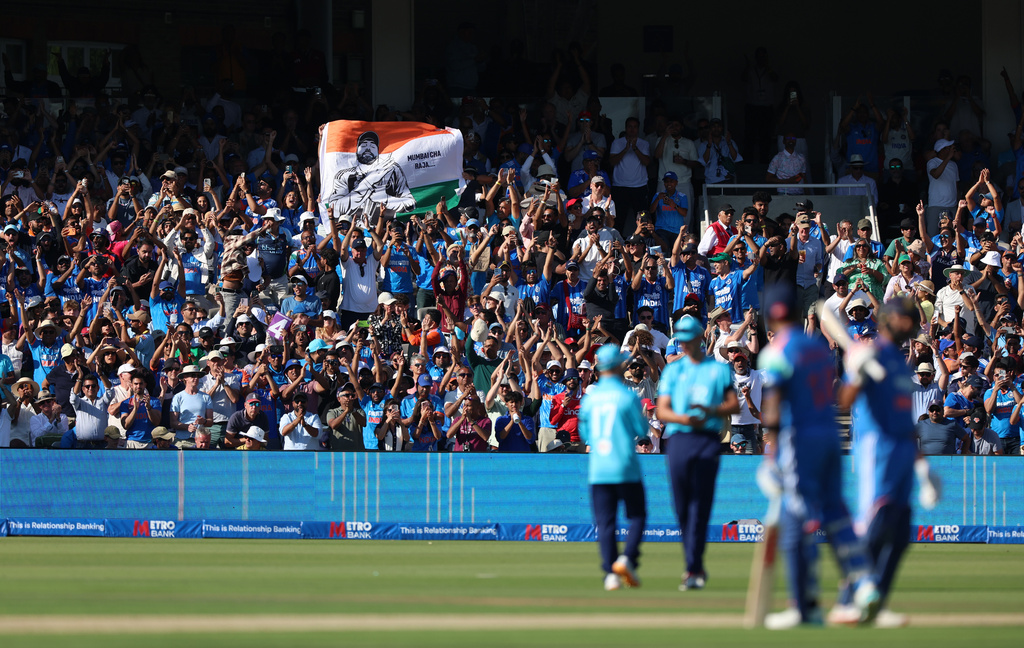 India fans celebrate in the stands after Rohit Sharma reaches his century during the third ODI between England and India, at Lord's cricket ground, London, Sunday, July 19, 2026. (Steven Paston/PA via AP)