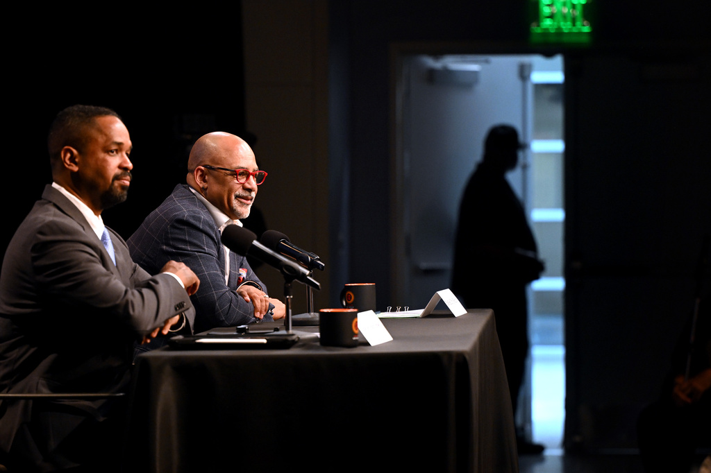 State Sen. Sharif Street, left, and state Rep. Christopher Rabb, left, wait for the WHYY studio door to close Wednesday, April 29, 2026 before start of their debate in the Democratic primary for the 3rd Congressional District in Philadelphia. (Tom Gralish/The Philadelphia Inquirer via AP)