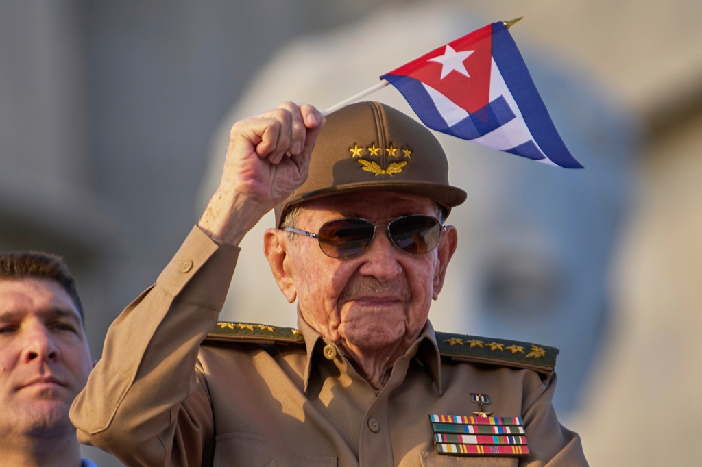 FILE - Raul Castro waves a Cuban national flag during a May Day parade at Revolution Square in Havana on May 1, 2025. (AP Photo/Ramon Espinosa, File)