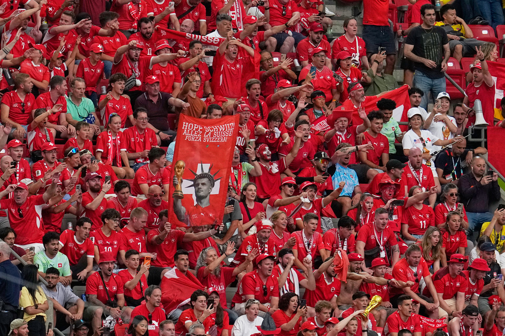 Switzerland fans cheer after defeating Colombia in a penalty shootout during the World Cup round of 16 soccer match in Vancouver, British Columbia, Tuesday, July 7, 2026. (AP Photo/Gregory Bull)