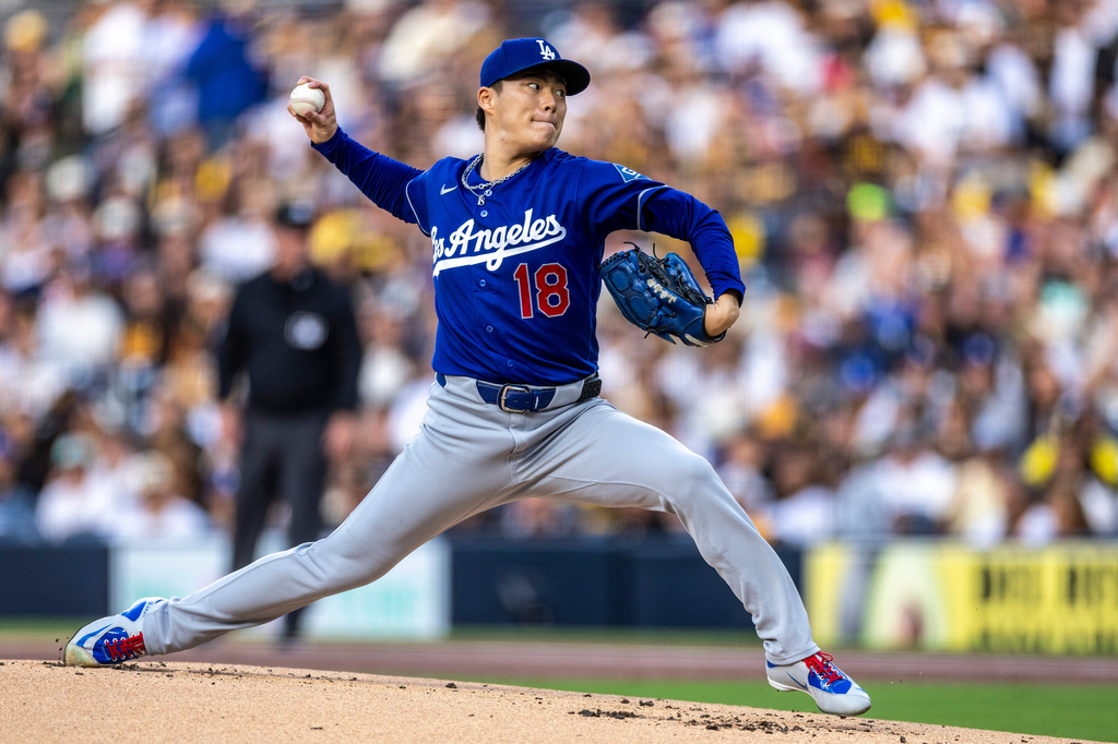 Los Angeles Dodgers starting pitcher Yoshinobu Yamamoto throws to a San Diego Padres batter in the first inning of a baseball game, Monday, May 18, 2026, in San Diego. (AP Photo/Tony Ding)