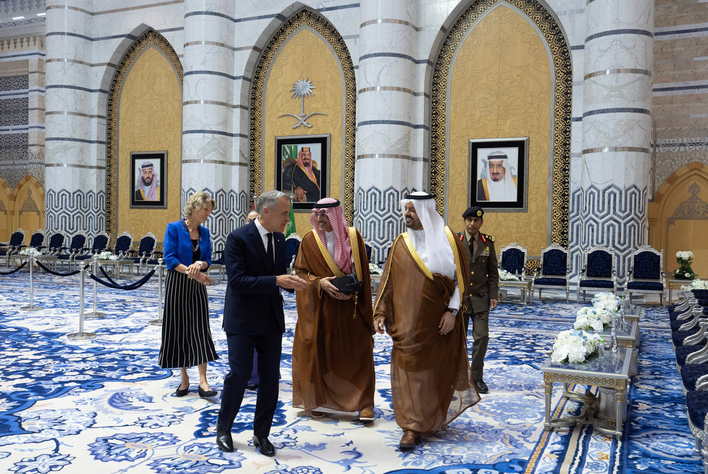 Canada Prime Minister Mark Carney and his wife Diana Fox Carney walk with Minister of Finance of the Kingdom of Saudi Arabia Mohammed bin Abdullah Al‚ÄëJadaan, middle, Prince Saud bin Mishaal bin Abdulaziz Al Saud and Director of Makkah Region Police Major General Saleh Al‚ÄëJabri (right) as they arrive In Jeddah, Saudi Arabia, Wednesday, July 8, 2026. (Adrian Wyld/The Canadian Press via AP)