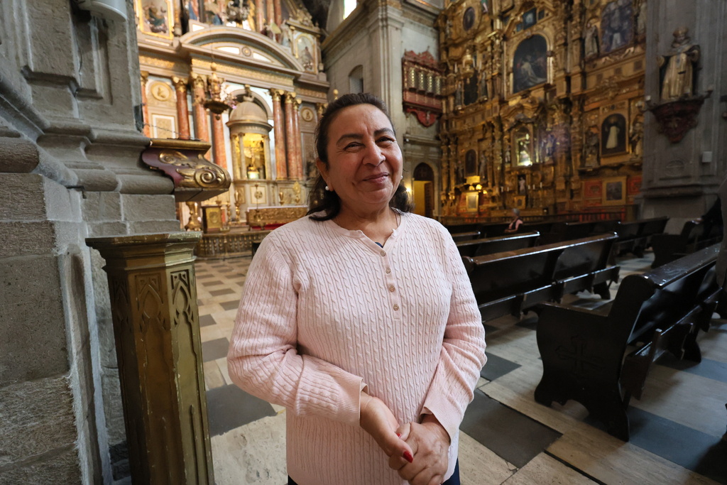 Maria Lourdes Flora, from Yucatan state, visits Santo Domingo church in Mexico City, Tuesday, Jan. 27, 2026. (AP Photo/Ginnette Riquelme)