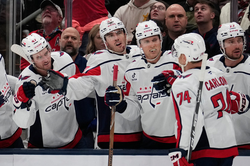 Washington Capitals defenseman John Carlson (74) is congratulated by teammates after scoring in the second period of an NHL hockey game against the Columbus Blue Jackets Friday, Oct. 24, 2025, in Columbus, Ohio. (AP Photo/Sue Ogrocki) Washington Capitals defenseman John Carlson (74) is congratulated by teammates after scoring in the second period of an NHL hockey game against the Columbus Blue Jackets Friday, Oct. 24, 2025, in Columbus, Ohio. (AP Photo/Sue Ogrocki)