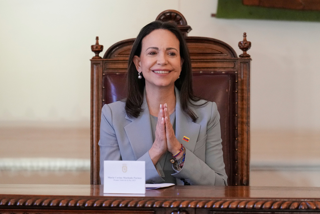 Venezuela's opposition leader Maria Corina Machado gestures during a ceremony in which she receives the keys to the city in Santiago, Chile, Thursday, March 12, 2026. (AP Photo/Gustavo Garello)