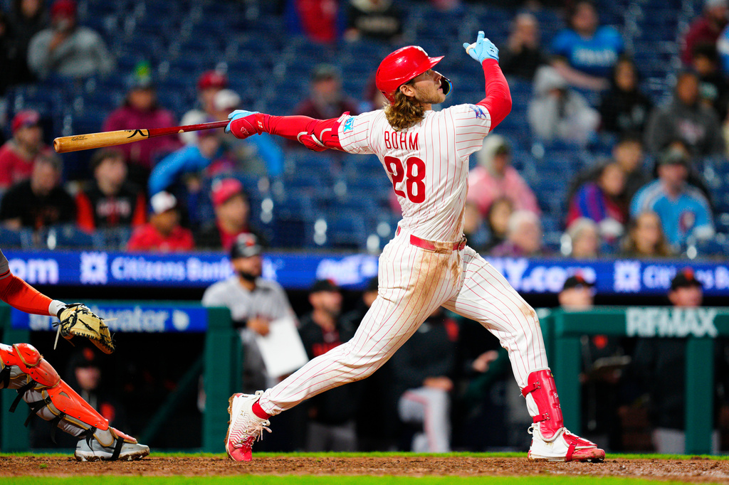 Philadelphia Phillies' Alec Bohm watches wal-off sacrifice fly during the 10th inning of the second baseball game of a doubleheader against the San Francisco Giants, Thursday, April 30, 2026, in Philadelphia. (AP Photo/Derik Hamilton)