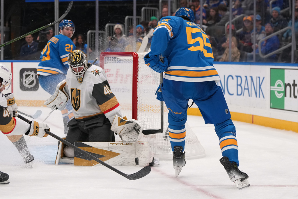 St. Louis Blues' Colton Parayko (55) is unable to score past Vegas Golden Knights goaltender Akira Schmid (40) during the second period of an NHL hockey game Saturday, Nov. 15, 2025, in St. Louis. (AP Photo/Jeff Roberson)