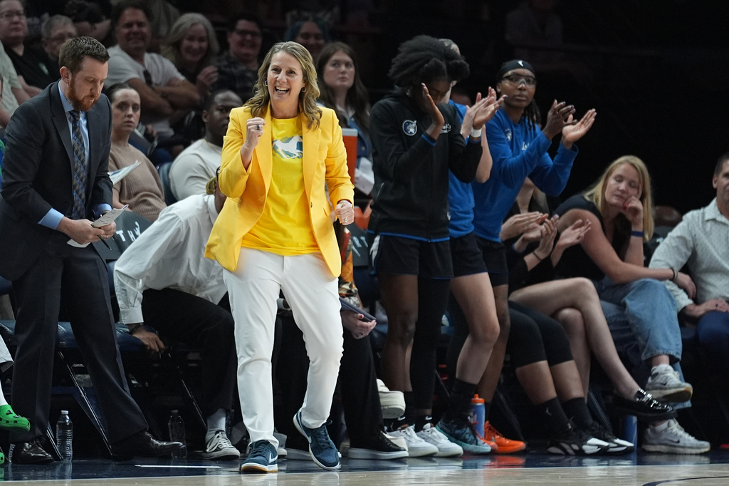 Minnesota Lynx head coach Cheryl Reeve, middle, celebrates during the second half of a WNBA basketball game against the Atlanta Dream Wednesday, May 27, 2026, in Minneapolis. (AP Photo/Abbie Parr)