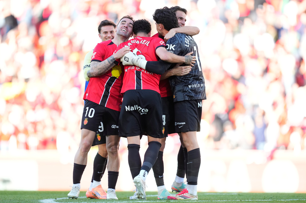 Mallorca players celebrate after a La Liga soccer match between Mallorca and Real Madrid in Palma de Mallorca, Spain, Saturday, April 4, 2026. (AP Photo/Jose Breton)