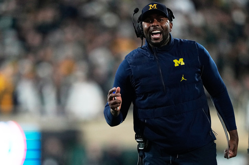 Michigan head coach Sherrone Moore reacts on the sideline during the first half of an NCAA college football game against Michigan State Saturday, Oct. 25, 2025, in East Lansing, Mich. (AP Photo/Ryan Sun) Michigan head coach Sherrone Moore reacts on the sideline during the first half of an NCAA college football game against Michigan State Saturday, Oct. 25, 2025, in East Lansing, Mich. (AP Photo/Ryan Sun)