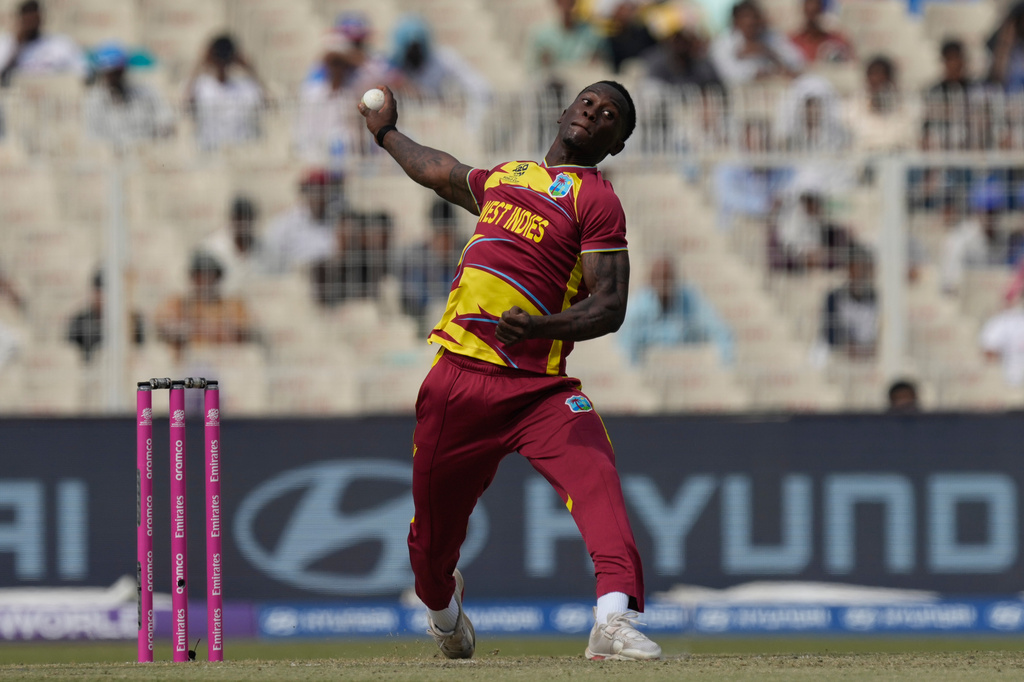 FILE - West Indies' Shamar Joseph bowls a delivery during the T20 World Cup cricket match between West Indies and Italy in Kolkata, India, on Feb. 19, 2026. (AP Photo/Bikas Das, File)