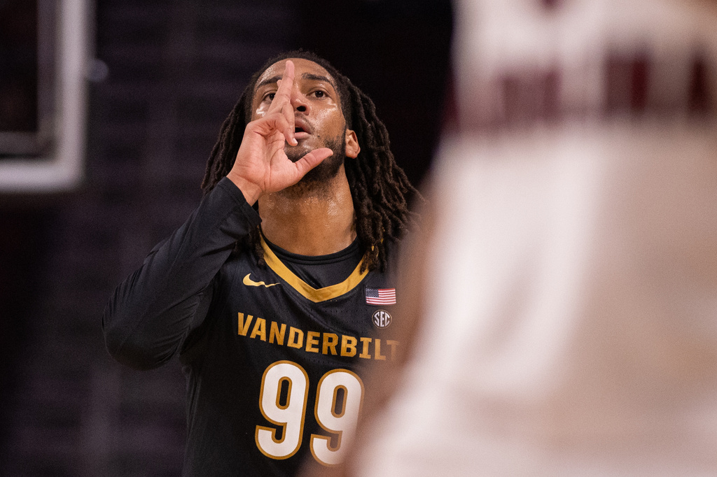 Vanderbilt forward Devin McGlockton (99) celebrates after scoring against the South Carolina in the first half of an NCAA college basketball game, Saturday, Jan. 3, 2026, in Columbia, N.C. (AP Photo/Scott Kinser)