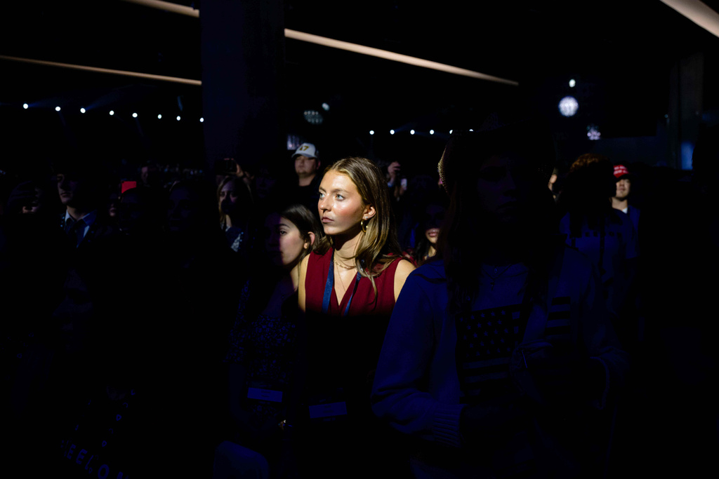 Attendees listen during Turning Point USA's AmericaFest 2025, Thursday, Dec. 18, 2025, in Phoenix. (AP Photo/Jon Cherry)
