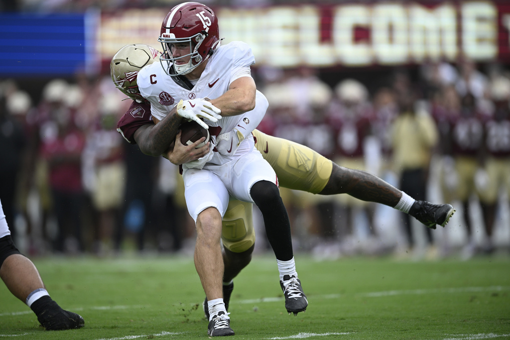 Alabama quarterback Ty Simpson (15) is sacked by Florida State linebacker Stefon Thompson (7) during the second half of an NCAA college football game, Saturday, Aug. 30, 2025, in Tallahassee, Fla. (AP Photo/Phelan M. Ebenhack)