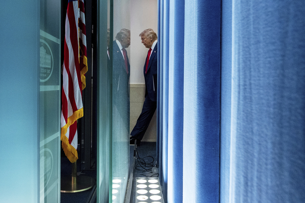 President Donald Trump arrives to speak with reporters in the James Brady Press Briefing Room at the White House, in Washington, Aug. 11, 2025. (AP Photo/Alex Brandon)