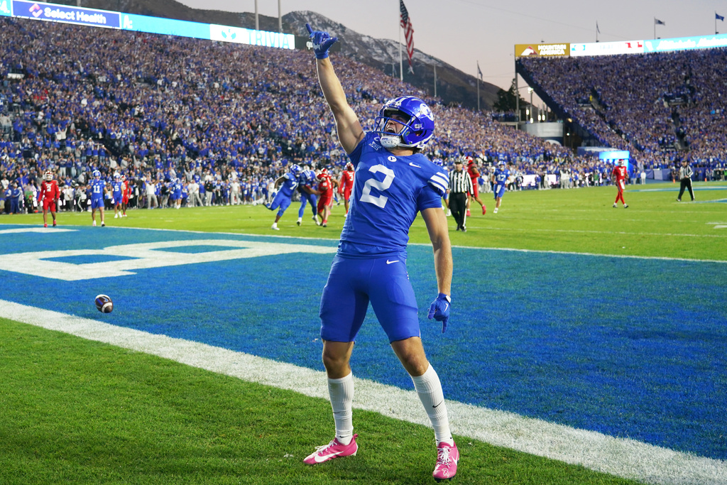 BYU wide receiver Chase Roberts (2) celebrates a touchdown during the first half of an NCAA college football game against Utah, Saturday, Oct. 18, 2025, in Provo, Utah. (AP Photo/George Frey)