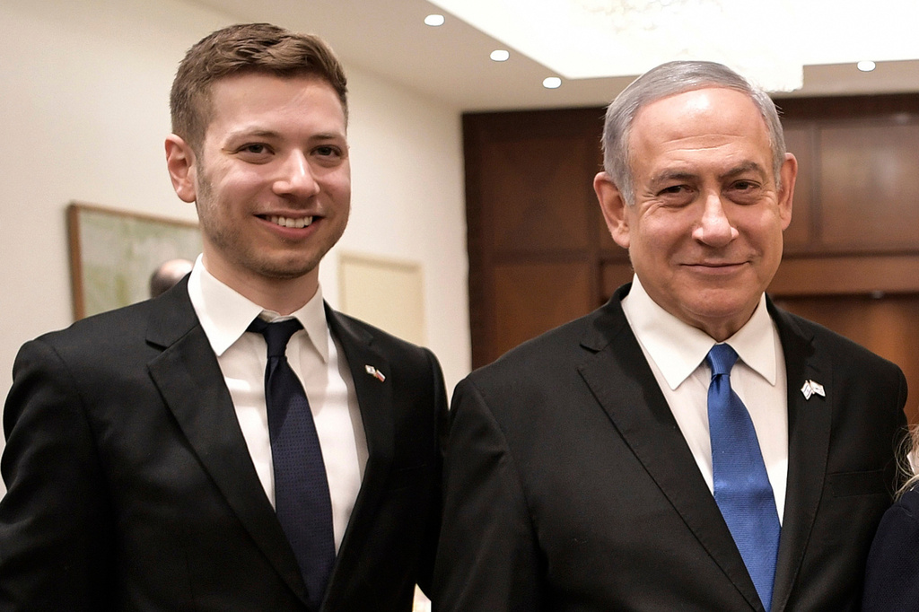 FILE - Israeli Prime Minister Benjamin Netanyahu and son Yair, left, pose for a photo in Tel Aviv, Israel, Jan. 23, 2020. (Aleksey Nikolskyi/Sputnik Kremlin Pool Photo via AP, File)