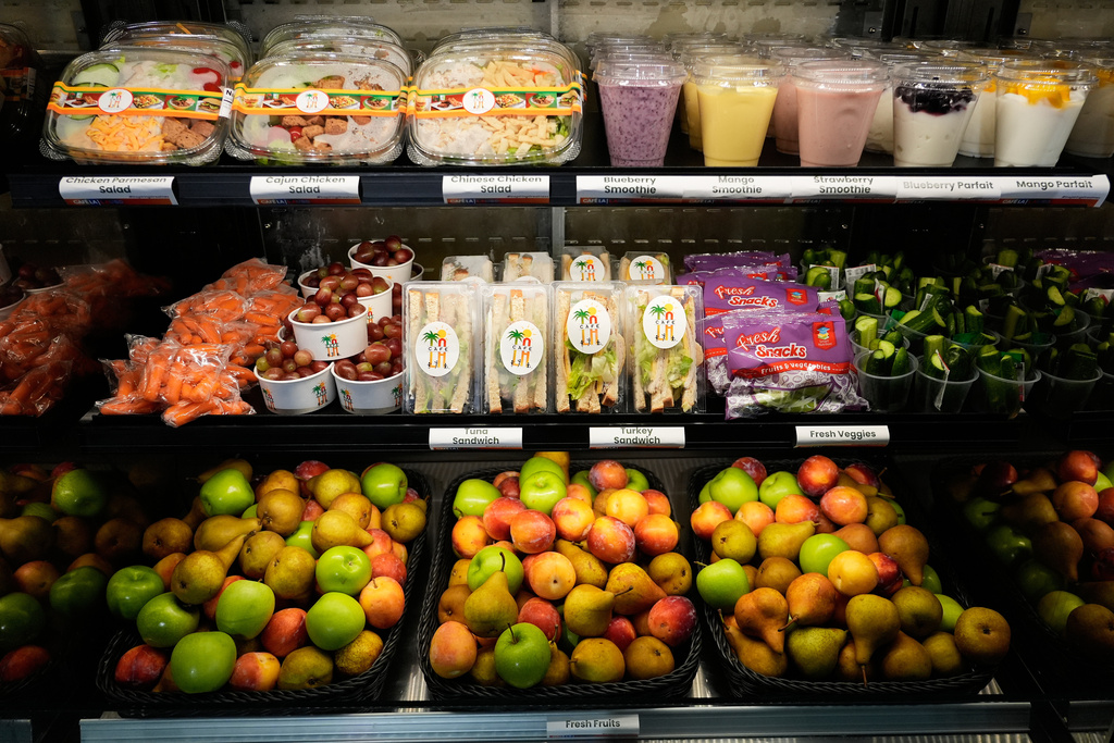 A selection of produce from California farmers and other food offered on the Belvedere Middle School menu is displayed before a news conference with Gov. Gavin Newsom, Wednesday, Oct. 8, 2025, in Los Angeles. (AP Photo/Damian Dovarganes)