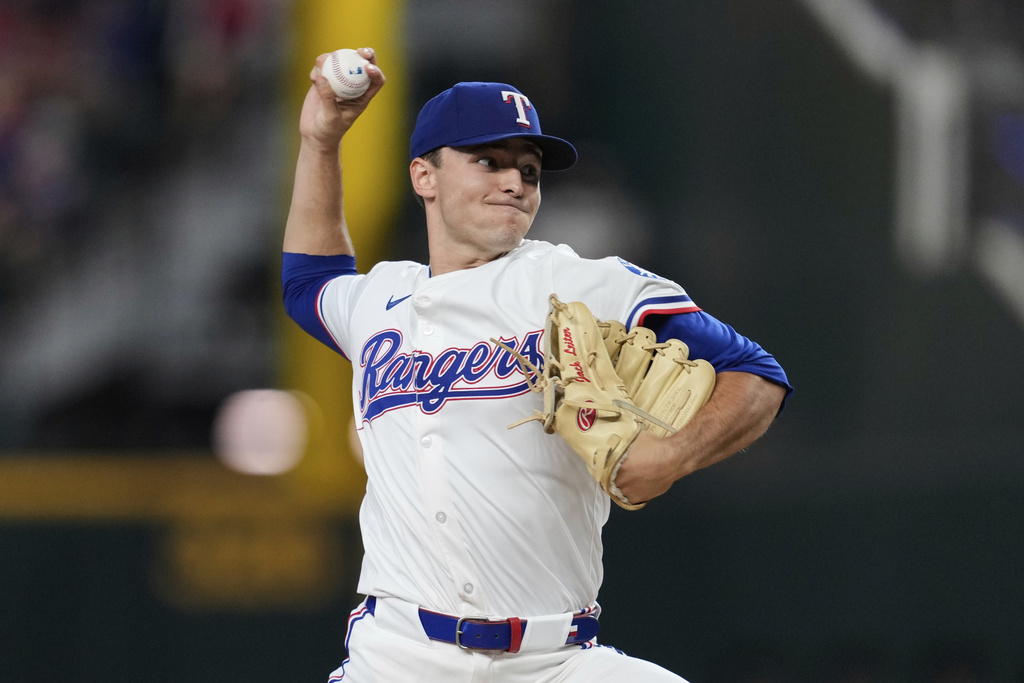 Texas Rangers starting pitcher Jack Leiter throws to the Cleveland Guardians in the first inning of a baseball game Saturday, Aug. 23, 2025, in Arlington, Texas. (AP Photo/Tony Gutierrez)