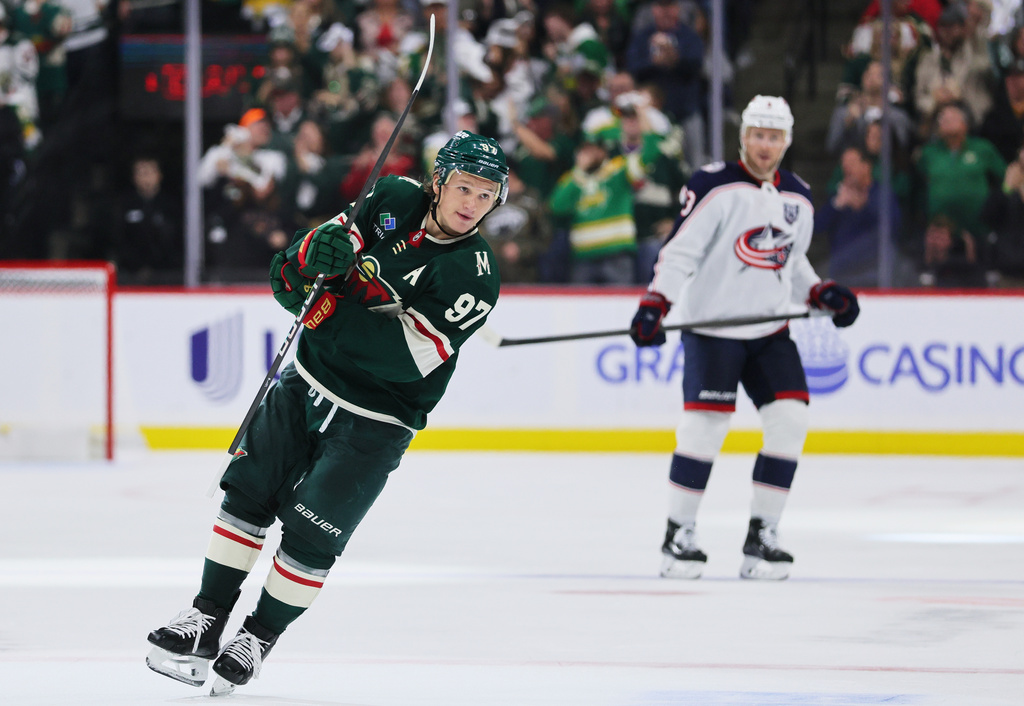 Minnesota Wild left wing Kirill Kaprizov (97) celebrates his goal during the second period of an NHL hockey game Saturday, Oct. 11, 2025, in St. Paul, Minn. (AP Photo/Adam Bettcher)