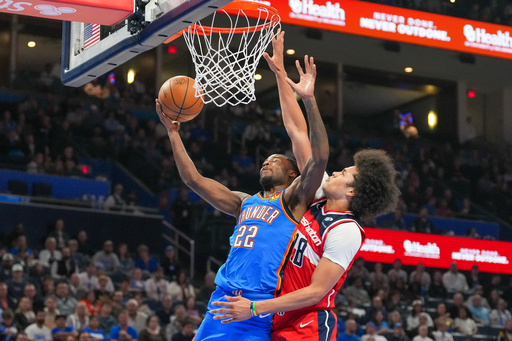 Oklahoma City Thunder guard Cason Wallace (22) shoots around Washington Wizards forward Kyshawn George, right, during the second half of an NBA basketball game, Thursday, Oct. 30, 2025, in Oklahoma City. (AP Photo/Kyle Phillips) Oklahoma City Thunder guard Cason Wallace (22) shoots around Washington Wizards forward Kyshawn George, right, during the second half of an NBA basketball game, Thursday, Oct. 30, 2025, in Oklahoma City. (AP Photo/Kyle Phillips)