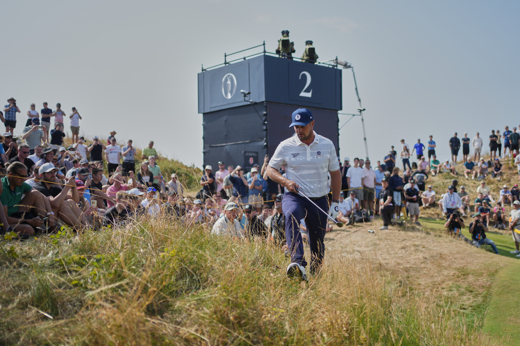 Bryson DeChambeau of the United States walks up to his ball in the rough by the 2nd green during the third day of the British Open Golf championships at Royal Birkdale golf club, in Southport, England, Saturday, July 18, 2026. (AP Photo/Jon Super)