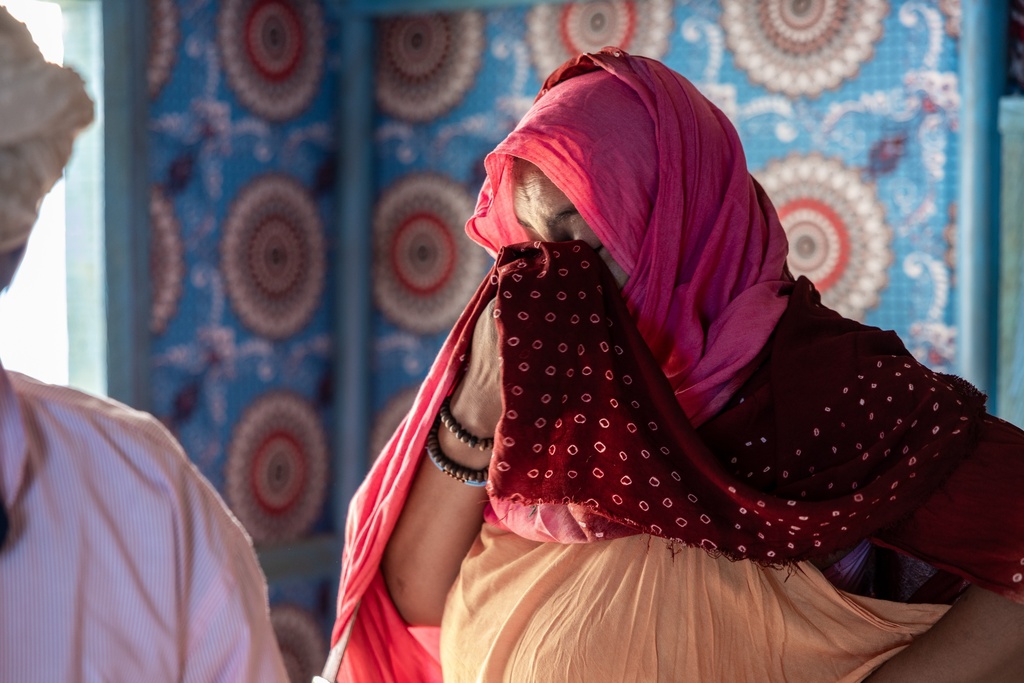 The mother of a young Malian woman, treated for her dangerously high fever and infection, cries at the Douankara health clinic in the Hodh El Chargui Region, Mauritania, Nov. 7, 2025. (AP Photo/Caitlin Kelly)