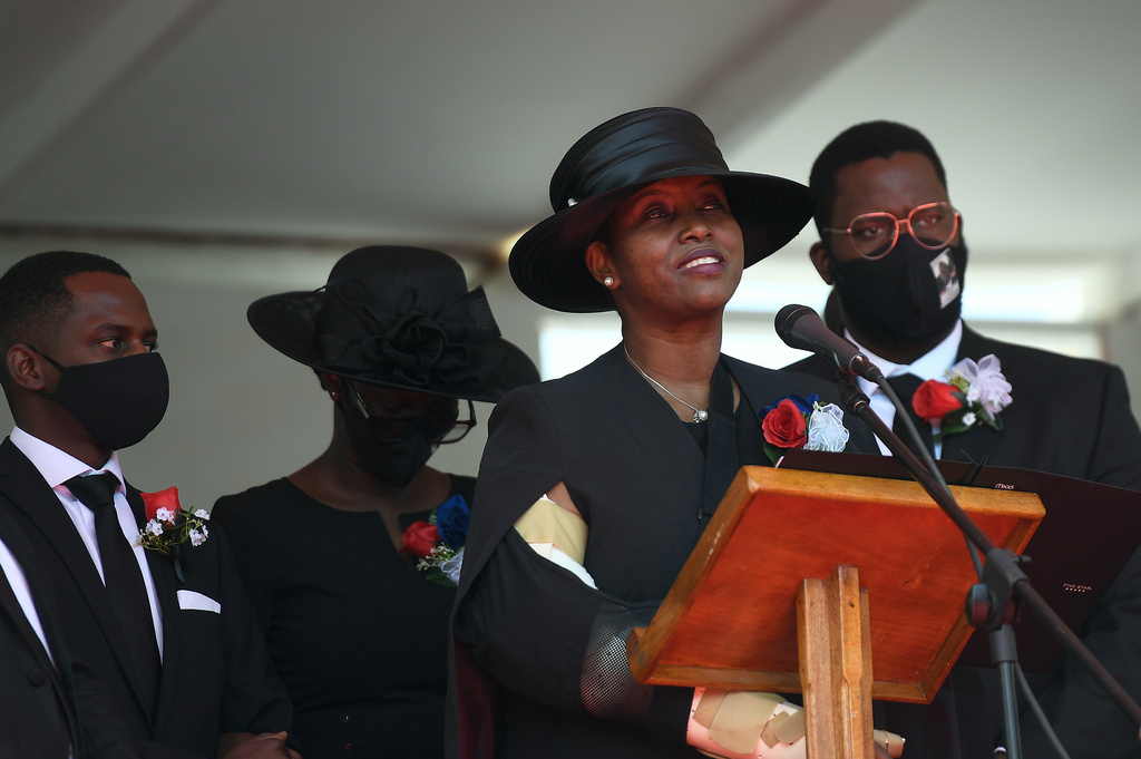 FILE - Former first lady of Haiti, Martine Moise, speaks, accompanied by her children, at the funeral of her slain husband, former President Jovenel Moise, on July 23, 2021, in Cap-Haitien, Haiti. (AP Photo/Matias Delacroix, File)