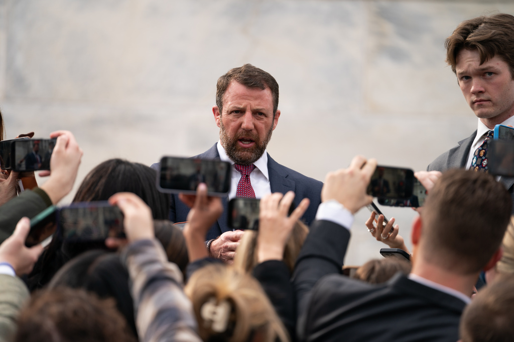 Sen. Markwayne Mullin, R-Okla., speaks to the press outside of the Capitol, Thursday, March 5, 2026, in Washington. (AP Photo/Allison Robbert)