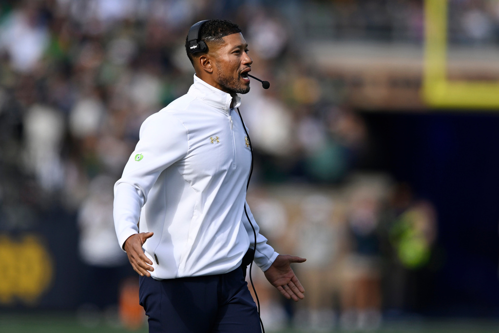 Notre Dame head coach Marcus Freeman yells to his players during the first quarter of an NCAA college football game against North Carolina State, Saturday, Oct. 11, 2025, in South Bend, Ind. (AP Photo/Paul Beaty)