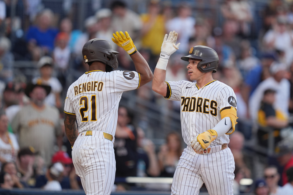 San Diego Padres' Freddy Fermin, right, celebrates with teammate Luis Rengifo after hitting a two-run home run during the fourth inning of a baseball game against the San Francisco Giants Saturday, Aug. 1, 2026, in San Diego. (AP Photo/Gregory Bull)